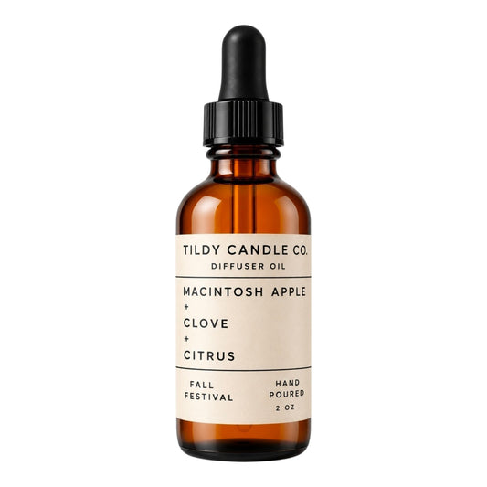 Tildy Candle Co. Fall Festival 2 oz diffuser oil in amber glass dropper bottle with Macintosh apple, clove, and citrus fragrance notes.